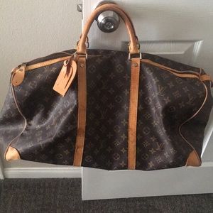 Used vintage Louis Vuitton luggage bag